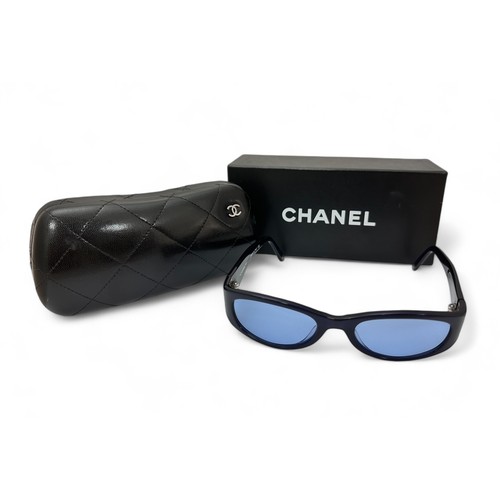 150 - A pair of navy Chanel Sunglasses with blue tinted lenses. In a quilted Chanel box and with outer box... 