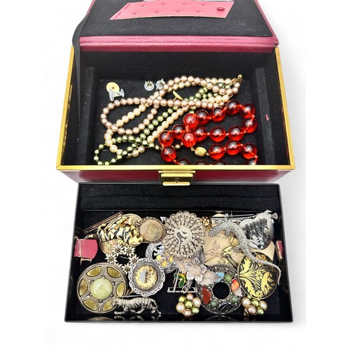 70 - A jewellery box containing jewellery. Includes a 9ct gold bar brooch, a silver and citrine brooch, s... 