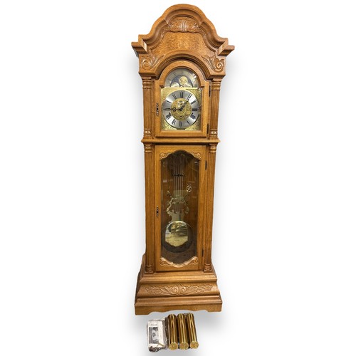 472 - Hermle - German Made Grandfather Clock. With pendulum, three weights and keys. Originally purchased ... 