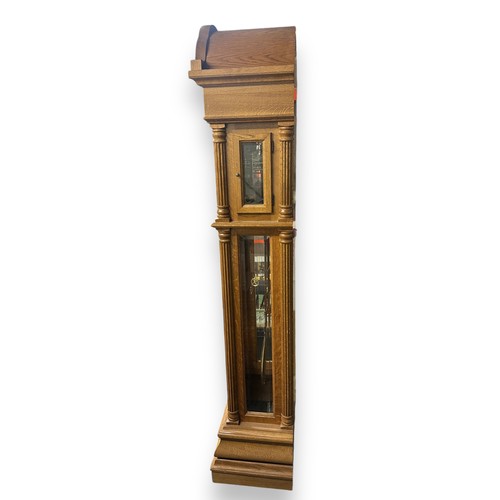 472 - Hermle - German Made Grandfather Clock. With pendulum, three weights and keys. Originally purchased ... 