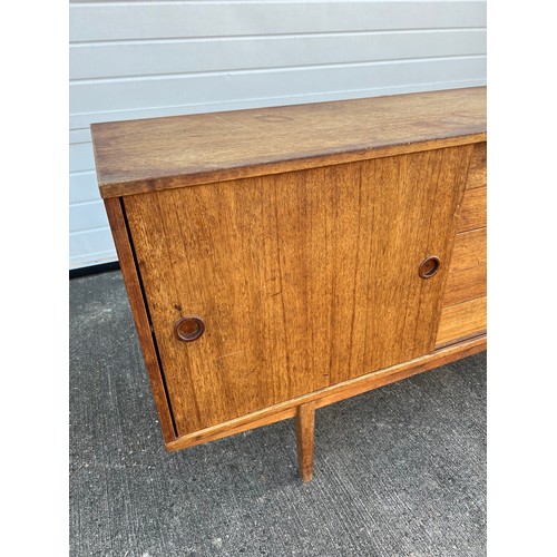 456 - Mid-century teak sideboard with two sliding doors and five central drawers, potentially Folke Ohlsso... 