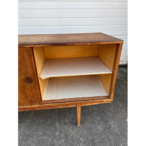 456 - Mid-century teak sideboard with two sliding doors and five central drawers, potentially Folke Ohlsso... 