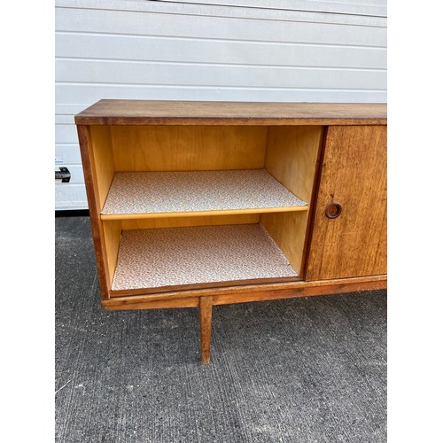 456 - Mid-century teak sideboard with two sliding doors and five central drawers, potentially Folke Ohlsso... 