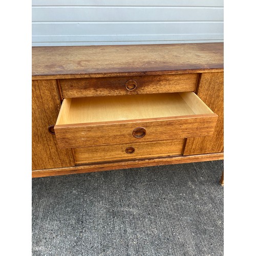 456 - Mid-century teak sideboard with two sliding doors and five central drawers, potentially Folke Ohlsso... 