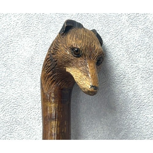 147A - A walking stick with the handle carved with the head of a fox with glass eyes, in the style of Swain... 