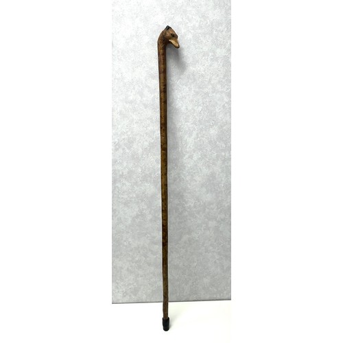 147A - A walking stick with the handle carved with the head of a fox with glass eyes, in the style of Swain... 