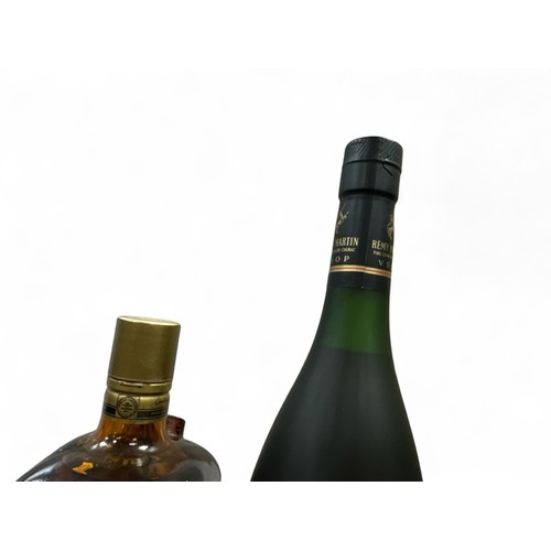 177 - Pair of Liquers to include a boxed and sealeed Rémy Martin Fine Champagne Cognac, 40% ABV / 70cl and... 