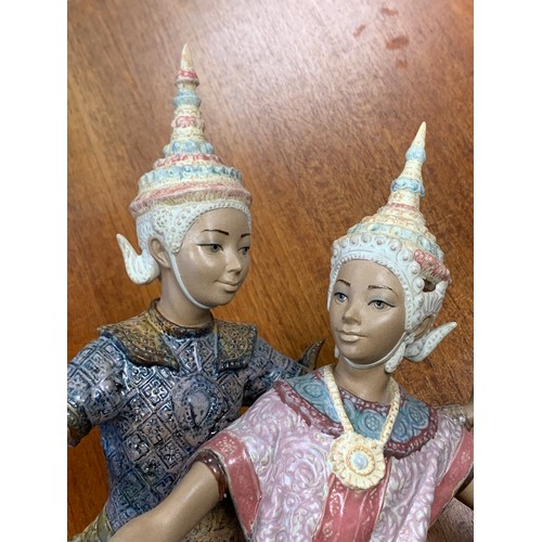 354 - Lladro, Thai Dancers, large standing sculpture. Stamped with Lladro to base. Height 52cm.