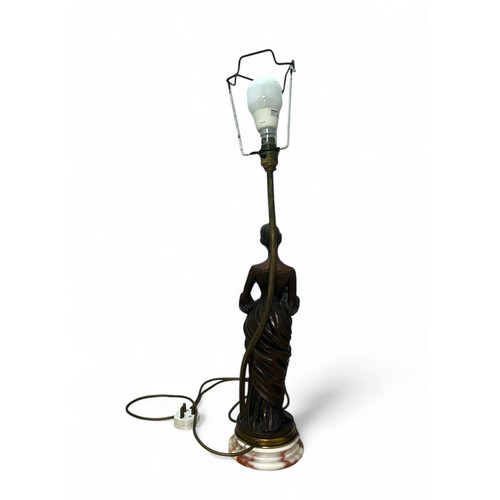 463A - An Art Deco Resin Lamp with a marble base of a Lady clutching a flower and her dress. Height measure... 