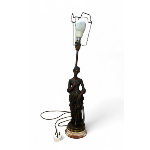 463A - An Art Deco Resin Lamp with a marble base of a Lady clutching a flower and her dress. Height measure... 