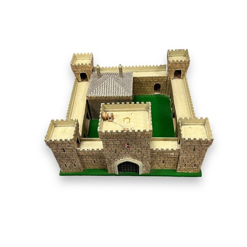 213 - Toy soldiers with custom made fort. The corners of the castle are bolted to the board, but the rest ... 