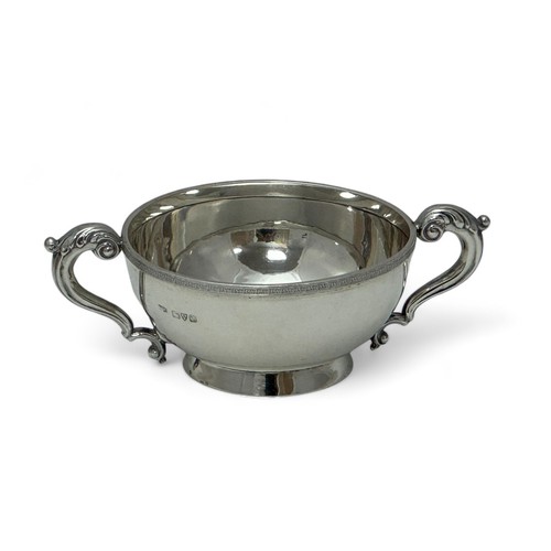 159 - Silver twin handled bowl with foliate rim decoration. Asprey & Co Ltd, Chester 1911. Diameter 11.2cm... 