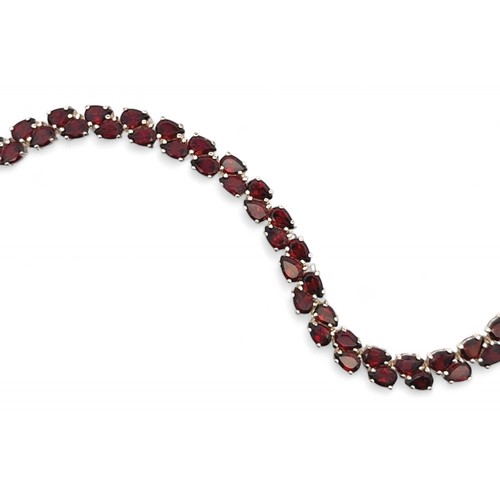 2 - A silver and garnet bracelet, length 20cm