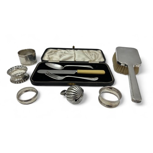 176 - A collection of silver and white metal items. Includes a cutlery set with silver knife and fork, two... 