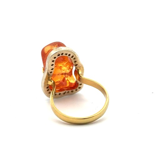 26 - An 18ct gold and silver-topped ring set with an unusual freeform mandarin garnet and thirty three su... 