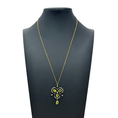 38 - A 9ct gold and silver vintage style necklace set with peridots, diamonds and a seed pearl. Chain 18