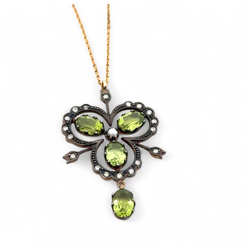 38 - A 9ct gold and silver vintage style necklace set with peridots, diamonds and a seed pearl. Chain 18