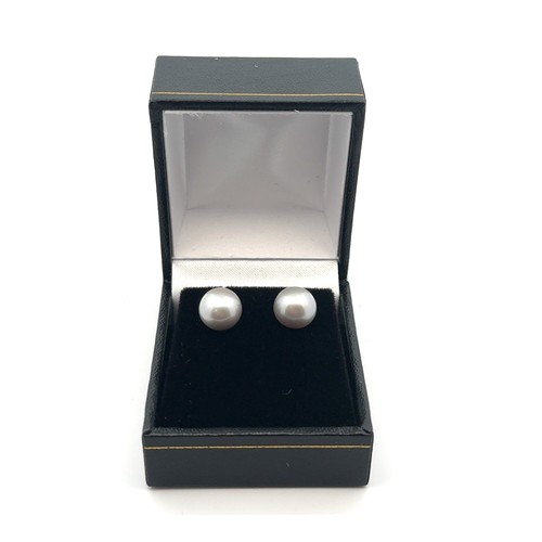 19 - A pair of 9ct yellow gold studs set with oblate spheroid grey cultured pearls.