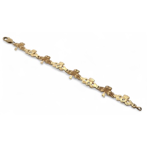 37 - Shamrock and Claddagh gold and diamond bracelet stamped 375 (9ct gold).  Alternate links of textured... 