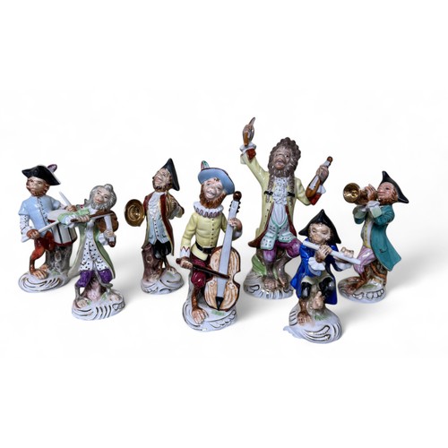 296 - Continental 20th Century seven piece Monkey Orchestra, after the original Meissen, comprising conduc... 