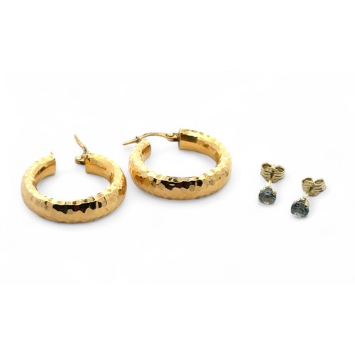 12 - Three pairs of gold earrings. A pair of hammered effect hoop earrings stamped 750, 18ct gold.  A pai... 