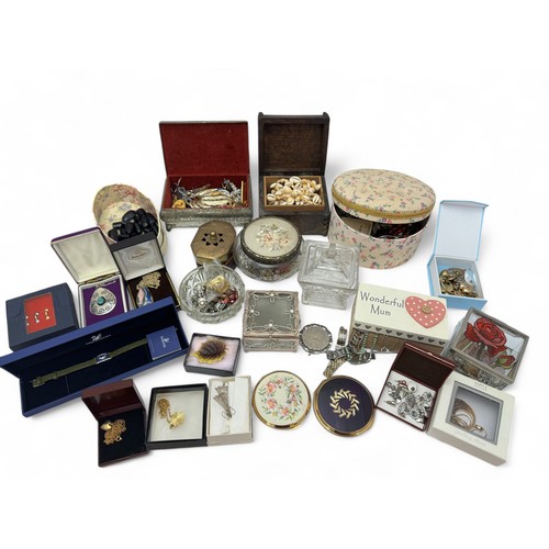 124 - Several jewellery and trinket boxes containing a large quantity of costume jewellery, a Swarovski br... 