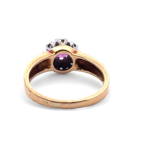 103 - An 18ct gold, ruby and diamond cluster ring. Size N. Weight 4.88g.