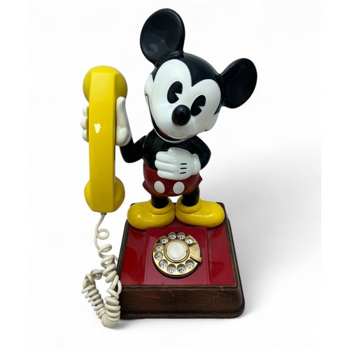 278 - A vintage Mickey Mouse 'dial up' telephone. Approx 39cm high.