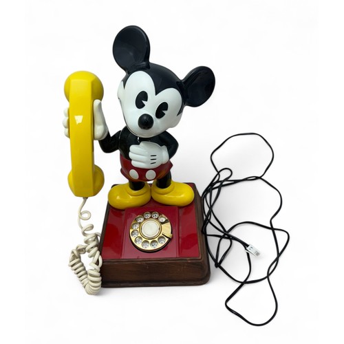 278 - A vintage Mickey Mouse 'dial up' telephone. Approx 39cm high.