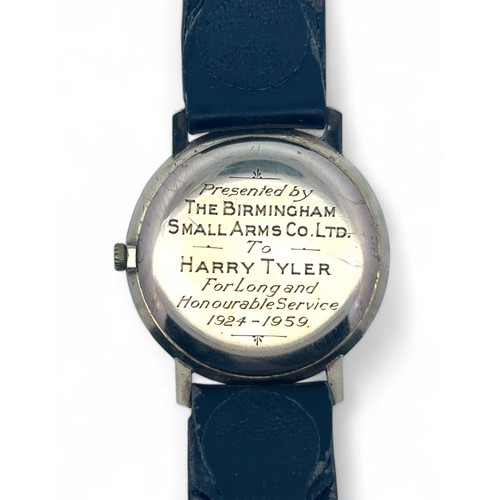 135 - A 9ct Hefik Gentleman's Watch. With leather strap. Inscription to back plate.