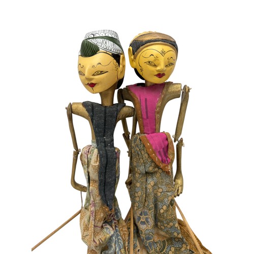 344 - Two Indonesian wooden rod puppets. approx 50cm in length