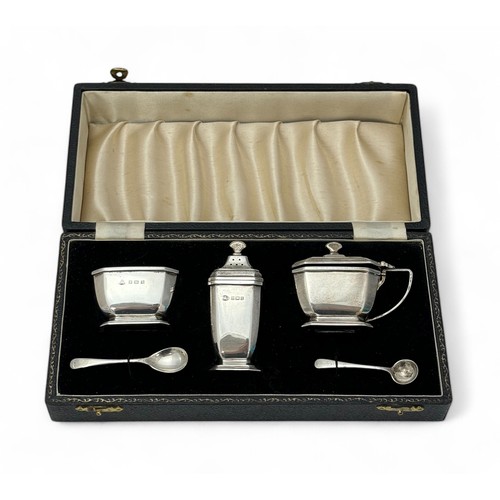 164 - A  three piece silver cruet set in the octagonal form by the Adie Brothers. Birmingham 1955. Weighab... 