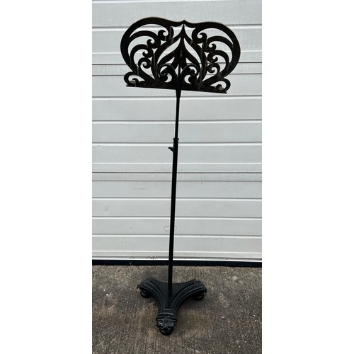 449 - A Victorian cast iron and polished brass music stand. Height 137cm (adjustable).