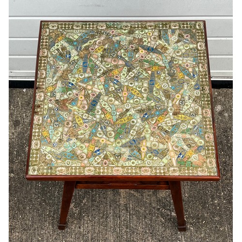 448 - A cigar label table on pine base. The top made up of hundreds of cigar labels under glass. 53.5 x 53... 