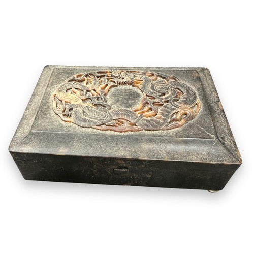 328 - 19th Century Chinese carved tortoiseshell snuff box with raised dragon decoration to lid. Stood on f... 