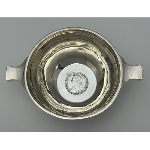 159A - Two quaiches. A quaich with inset 1897 coin, R & W Sorley, Glasgow 1896. Width inc handles 15.2cm. A... 