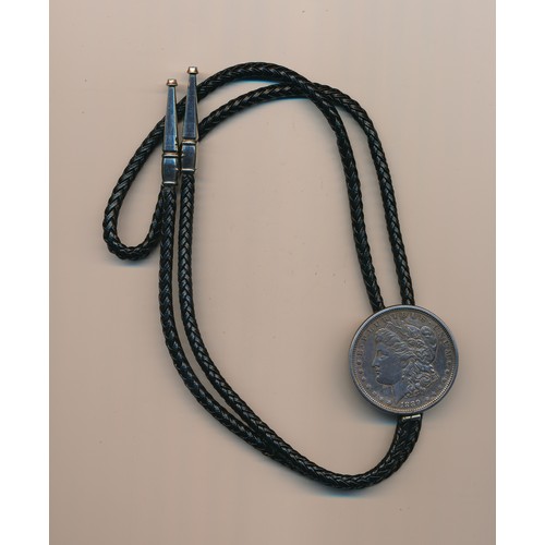 249 - United States of America 1889 mounted Morgan Dollar, Mounted in a Cord Bolo Tie.