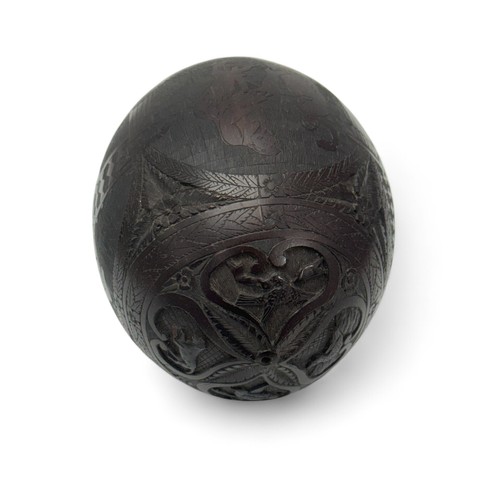 71 - 19th / 20th Century carved coconut bugbear money box. Central figural band, carved face (eyes missin... 