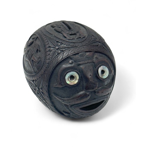 79 - 19th / 20th Century carved coconut bugbear money box. Figural central band, front facing carved face... 