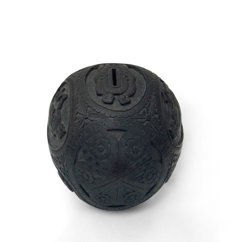 79 - 19th / 20th Century carved coconut bugbear money box. Figural central band, front facing carved face... 