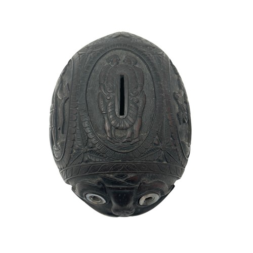 79 - 19th / 20th Century carved coconut bugbear money box. Figural central band, front facing carved face... 