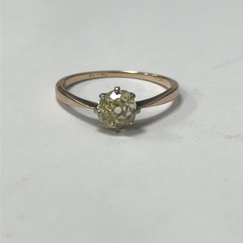 25 - An old mine cut fancy light yellow (estimated) diamond ring, size O. Set in unmarked gold.  Clarity ... 