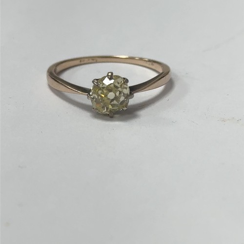 25 - An old mine cut fancy light yellow (estimated) diamond ring, size O. Set in unmarked gold.  Clarity ... 