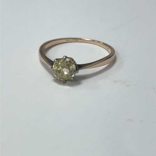 25 - An old mine cut fancy light yellow (estimated) diamond ring, size O. Set in unmarked gold.  Clarity ... 