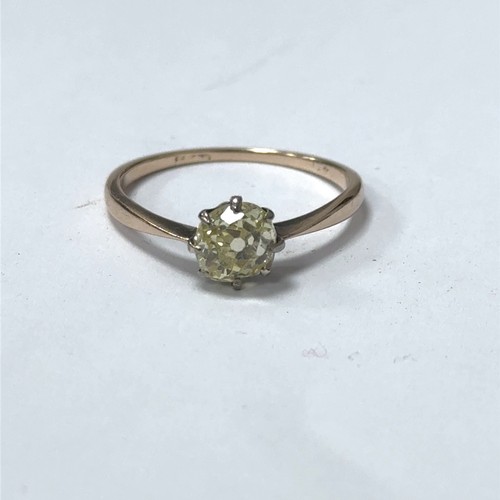 25 - An old mine cut fancy light yellow (estimated) diamond ring, size O. Set in unmarked gold.  Clarity ... 