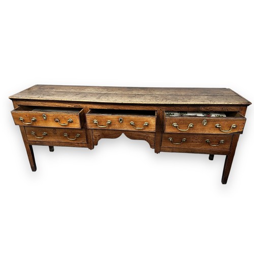 443 - Late 18th / Early 19th Century oak five drawer dresser base. Brass fittings, rectangular top split o... 