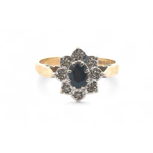 47 - A sapphire and diamond 18ct gold cluster ring, size   3.4g