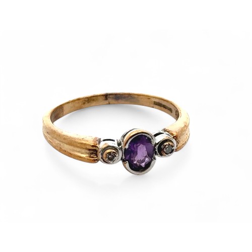 69 - An amethyst ring with diamond accents, set in 9ct gold. Size P. Weight 2.26g.