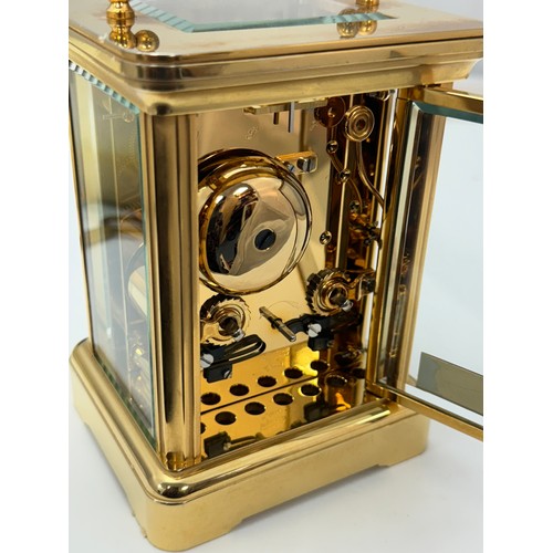 172 - Garrard & Co. 20th century brass four glass carriage clock, the dial bearing Roman numerals, marked ... 