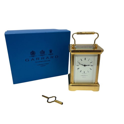 172 - Garrard & Co. 20th century brass four glass carriage clock, the dial bearing Roman numerals, marked ... 